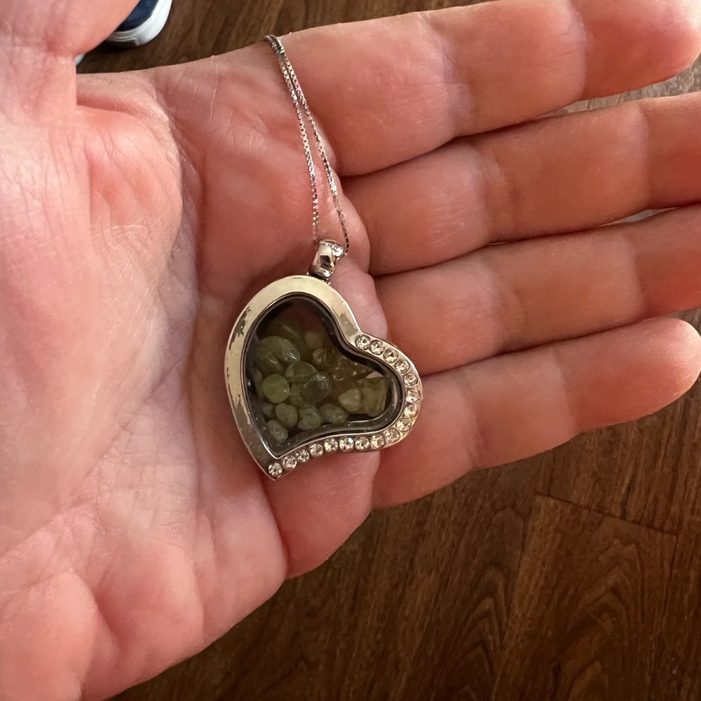 Heart shaped locket with peridot stones and cz’s on a 20” s925 chain